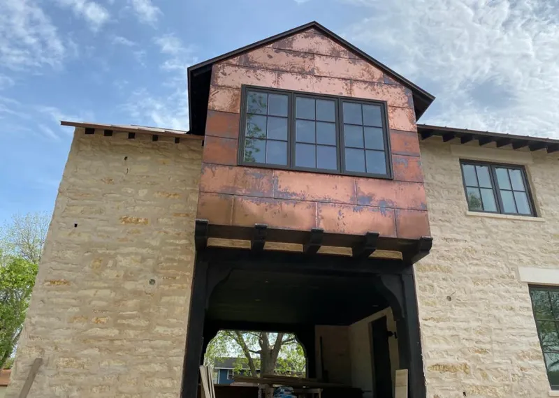 Copper metal panel facade on a stone building for Skylight Installation in Southeast Arcadia