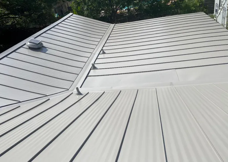 Solar attic fan installed on a metal roof for Roof Ventilation in Southeast Arcadia